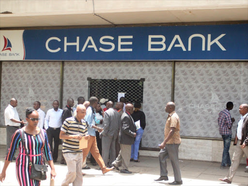 Depositors wait outside Chase Bank's branch on Mama Ngina Street in Nairobi on April 7, 2016, when the bank was placed under receivership over liquidity problems. Photo/ENOS TECHE