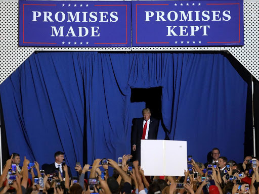 US President Donald Trump appears on stage at a rally in Harrisburg, Pennsylvania, US April 29, 2017. /REUTERS