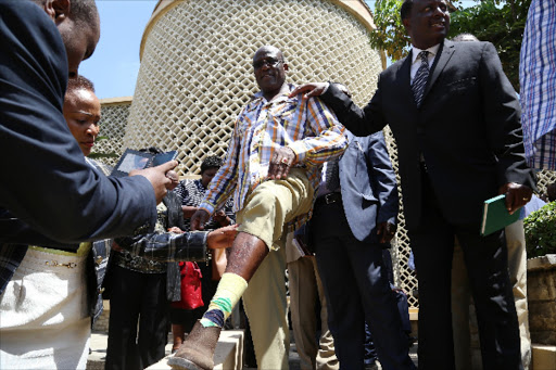 Machakos senator Johnstone Muthama displays injuries he sustained after Opposition MPs protested in parliament during the security bill debate yesterday.There was chaos in parliament during the debate of the bill that was opposed by opposition MPs.Photo/HEZRON NJOROGE