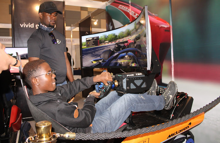 A gamer plays THE GT game during gaming symposium at Sarit Centre on November 19, 2023.