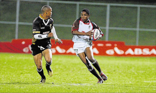 FLEET-FOOTED: Vuyo Zangqa Border's fullback, sidesteps a Boland Cavaliers player in his playing days Picture: FILE