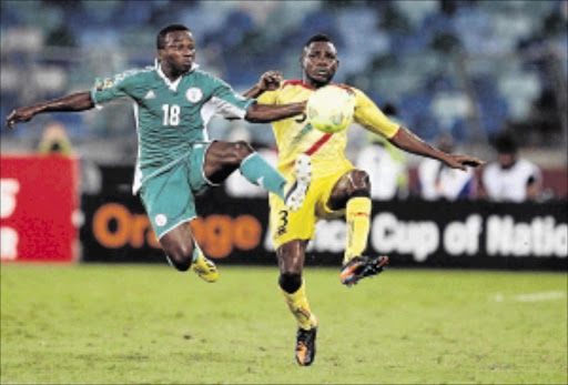 TUSSLE: Ejike Uzoenyi with Adama Tamboura of Mali during the 2013 Africa Cup of Nations Photo: Steve Haag/Getty Images