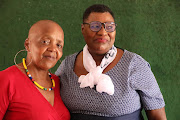 Dipuo Ranamane-May, right, and Carol Dyantyi, leaders of
Dipuo Difedile Club Care in Orlando West .