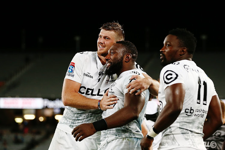 Tendai Mtawarira (C) of the Sharks celebrates victory with his teammates after defeating the Blues in a Super Rugby match at Eden Park, Auckland, New Zealand on March 31 2018.