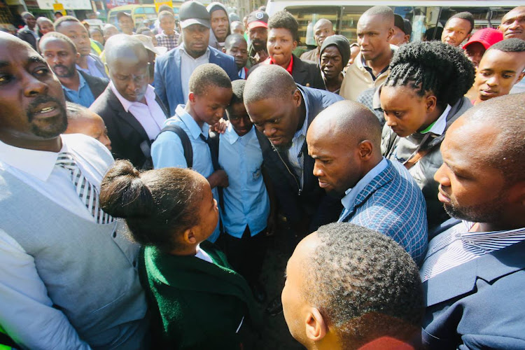 Nairobi Governor Johnson Sakaja interacting with learners stranded at CBD after government postponed school reopening dates on Monday, April 29, 2024.