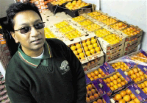 QUALITY COUNTS: Atul Kumar Sana buys for Fruit and Veg City at the Johannesburg Fresh Produce Market. Photo: Daniel Born. © Unknown.