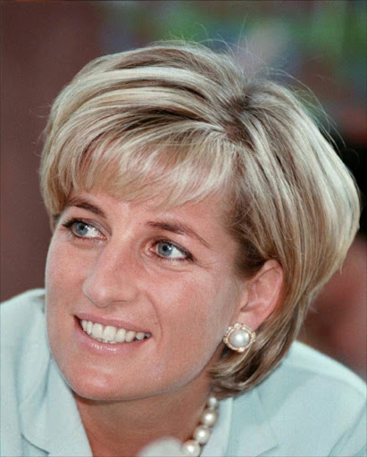 ** FILE ** Diana, the Princess of Wales smiles during her visit to Leicester England in this May 27, 1997 file photo. The mounds of flowers are long gone from the gates of Kensington Palace, but the presence of Princess Diana lingers. it has been 10 years since Diana's death in a Paris car crash, when many Britons were poleaxed by grief for a vivacious and troubled woman who was at once princess, style icon, charity worker and tabloid celebrity. (AP Photo/Pool)