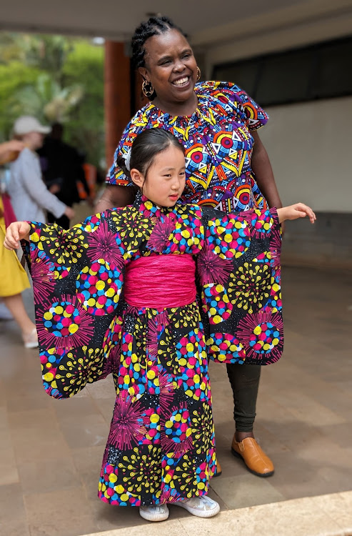 Attendees pose for a photo at the Japan Day event held at the Nairobi National Museum on November 18, 2023. The child is wearing a Yukata, a traditional garment worn during special events and occasions in Japan.