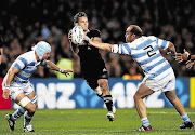 Aaron Cruden, as comfortable on a rugby field as he is on a half-pipe, goes for the gap against Argentina on Sunday. The 22-year-old skateboard wizard was called up for the All Blacks when injuries took their toll last week Picture: PHIL WALTER/GALLO IMAGES