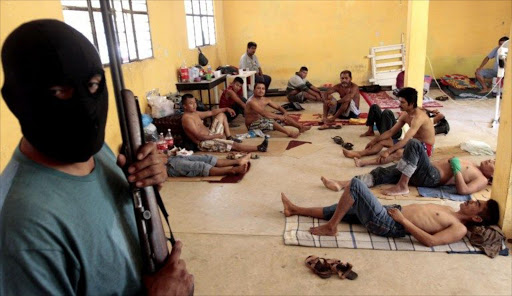 People arrested by residents of Ayutla de los Libres forming their own vigilante police forces, are kept under custody inside a house at the village of Ayutla de los Libres in the Mexican southern state of Guerrero.