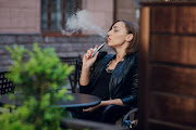 Woman smoking an electronic cigarette.