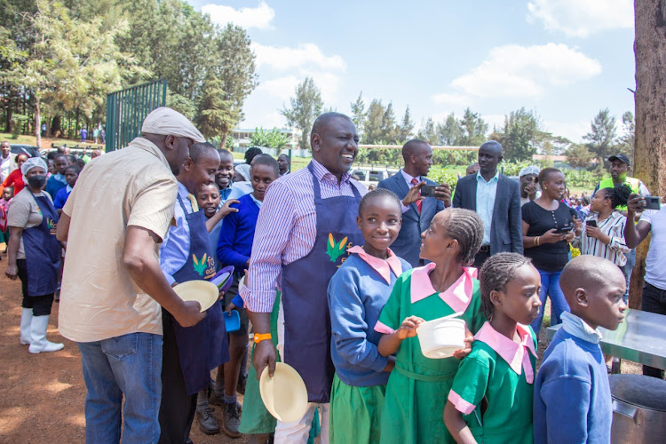 Deputy President William Ruto serving pupils of Mukarara Primary school on Wednesday, May 11, 2022.