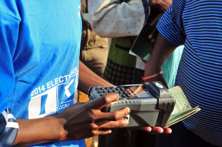 An IEC official scans an ID as South Africans cast their vote in the previous election. File Photo.