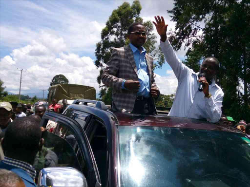 Murang’a Governor Mwangi Wairia and Kigumo MP Jamleck Kamau in Gakira village on Wednesday /ALICE WAITHERA