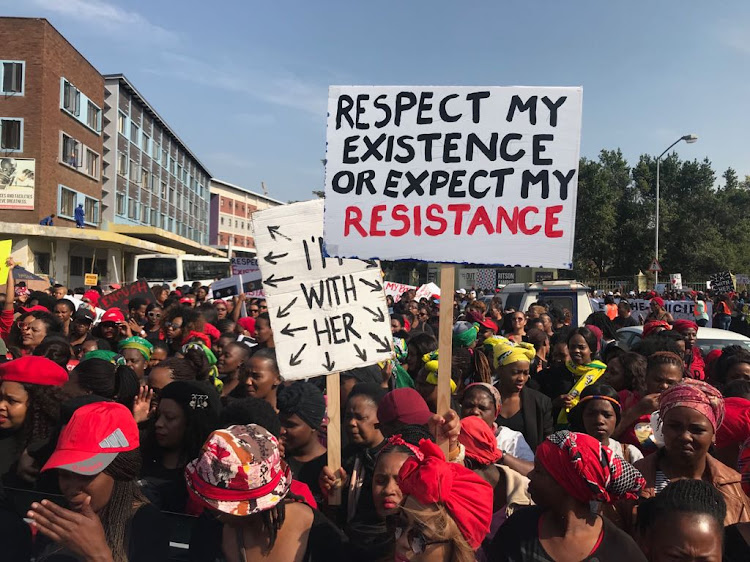 Women make their way through the streets of Durban to the city hall where they will be handing over a memorandum to government officials as part of the #TotalShutdown march on August 1, 2018.