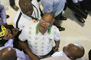 Jacob Zuma looks at stalls and greets exhibitors at a exhibition centre hosted at the National ANC Elective Conference in Nasrec, Johannesburg.