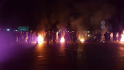 Lenasia residents blocked several roads with rocks and burning tyres.