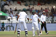 Shan Masood of Pakistan and Asad Shafiq of Pakistan celebrate their 100 partnership during day 3 of the 2nd Castle Lager Test match between South Africa and Pakistan at PPC Newlands on January 05, 2019 in Cape Town, South Africa. 