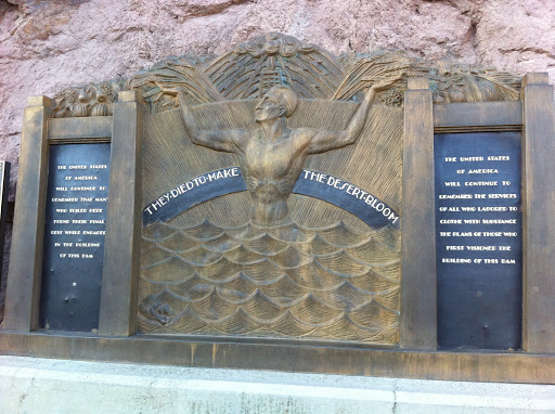 THEY DIED TO MAKE THE DESERT BLOOM  THE UNITED STATES OF AMERICA WILL CONTINUE TO REMEMBER THAT MANY WHO TOILED HERE FOUND THEIR FINAL REST WHILE ENGAGED IN THE BUILDING OF THIS DAM THE UNITED...