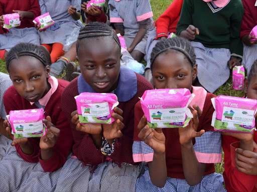 Mt Kenya Salvation Army Primary School pupils show some of the sanitary pads given by the Nyeri county government. file