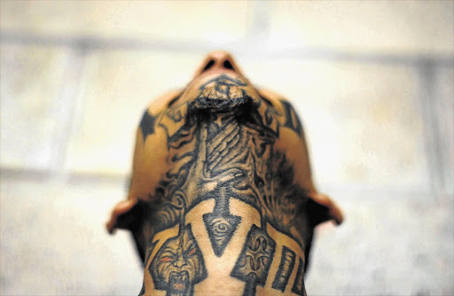 BY THE THROAT: Many people grow up to regret youthful tattoos