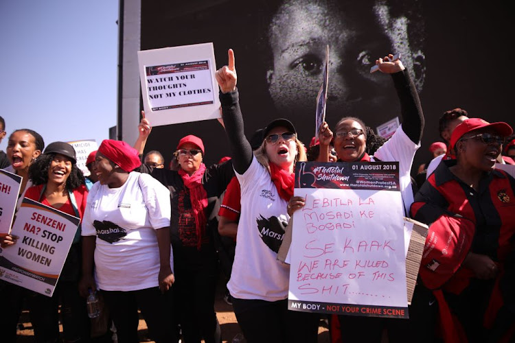 Women take part in the #TotalShutdown march in Pretoria on August 1, 2018.