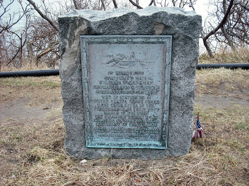 The plaque reads: "In memory of Boatswain's Mate William H. Cashman, Surfman Frank W. Griswold, Surfman Edward P. Stark, who of Station No. 31 United States Coast Guard lost their lives in the...