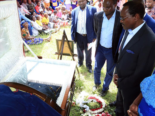 Wiper leader Kalonzo Musyoka and other leaders pay their respects to the remains of the late Police Commissioner Charles Kyale Mwau during his burial at Kasikeu, Kilome, Makueni county on Saturday, April 22. /DENNIS KAVISU)