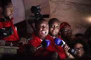 Economic Freedom Fighters (EFF) leader Julius Malema (C) speaks to journalists after being ordered to leave the parliamentary chamber, during President Jacob Zuma's State of the Nation address in Cape Town, South Africa, 11 February 2016. Picture Credit: SUMAYA HISHAM