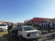 More than 100 people are gathered outside Supa store in Thokozoza Park, Soweto. Many say they are there to purchase alcohol, saying the ban was unnecessary to begin with.