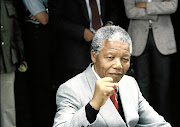 Nelson   Mandela, who would be turning 100 years old tomorrow, said 'Overcoming poverty is not a gesture of charity. It is an act of justice.'     /  Pierre Oosthysen