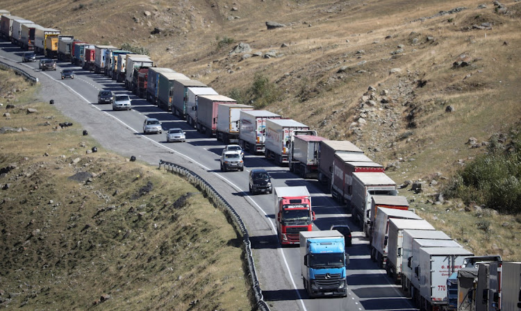 Trucks and cars queue to leave Russia at the border with Georgia on September 26 2022. Picture: IRAKLI GEDENIDZE/REUTERS