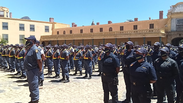 Police officers and Cape Town metro cops listen to police minister Bheki Cele at the Castle of Good Hope ahead of the state of the nation address on February 10 2022.