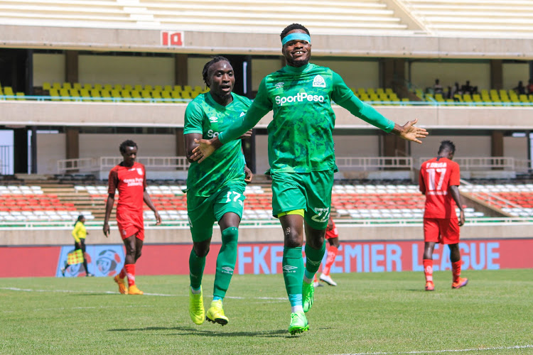 Gor Mahia striker Benson Omalla celebrates with teammate Lyson Muyonga Khavuchi after scoring against Bandari in a past match at Moi Stadium in Kasarani.