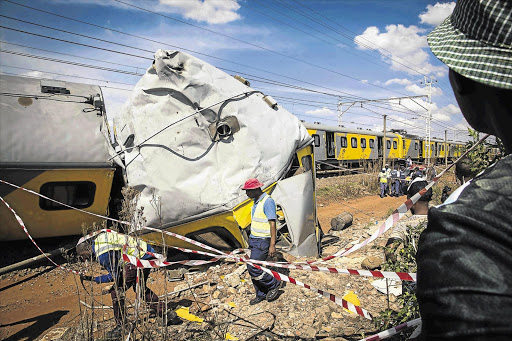 MANGLED METAL: A derailed carriage after two passenger trains collided head-on between Kaalfontein and Tembisa stations on the East Rand yesterday. One passenger was killed and 242 injured