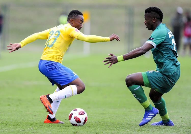 Mamelodi Sundowns attacking midfielder Lebohang Maboe (L) dribbles past Bonginkosi Ntuli (R) of AmaZulu FC during the Absa Premiership encounter at King Zwelentini Stadium in Umlazi on September 16 2018.