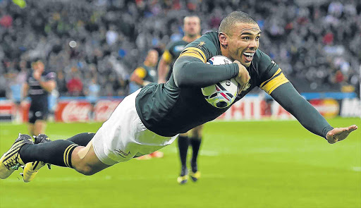 TRY, TRY AND TRY AGAIN: Bryan Habana scored a hat-trick of tries for the Boks in their destruction of the USA. In doing so Habana equalled Jonah Lomu’s World Cup try-scoring record of 15 Picture: REUTERS