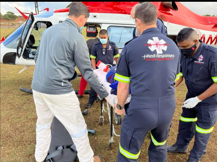 A man is being airlifted to hospital after a driver accidentally drove over him at a Ballito carwash.