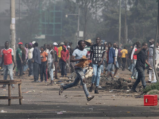 NASA supporters in a looting spree during demonstrations following Raila Odinga's return from US on Monday, November 17, 2017. /ENOS TECHE