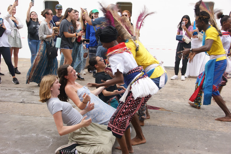 Tourists enjoy dances by the Sengenya dancing troupe at the Port of Mombasa on Friday