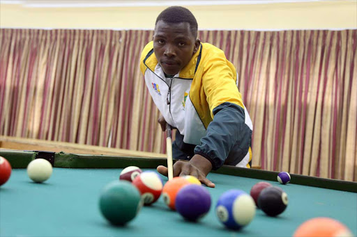 NATIONAL PRIDE: St Patrick’s pupil, Olwethu Ngwekazi, poses at the pool table at his school after returning from competing for the South Africa team in Ireland last month Picture: SIBONGILE NGALWA
