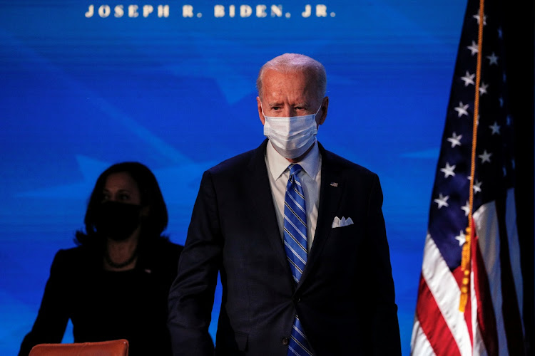 US President-elect Joe Biden reacts while delivering remarks during a televised speech on the current economic and health crises at The Queen Theatre in Wilmington, Delaware, US, January 14, 2021.