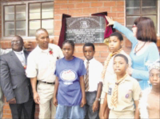 Caption: A joyous moment: MEC for Education Ina Cronje unvails one of the state of the art school in Inanda, north of Durban where learners had been housed in a tin school for the past 17 years