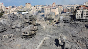 An aerial view shows houses and buildings destroyed by Israeli strikes in Gaza City.