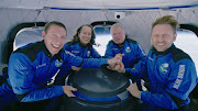 Star Trek actor William Shatner poses with Audrey Powers, Blue Origin's vice president of mission and flight operations and a former NASA flight controller and engineer; Chris Boshuizen, the co-founder of satellite company Planet Labs and a former space mission architect for NASA; and Glen de Vries, the co-founder of Medidata Solutions, a life science company during the Blue Origin New Shepard mission NS-18 suborbital flight near Van Horn, Texas, US October 13, 2021.
