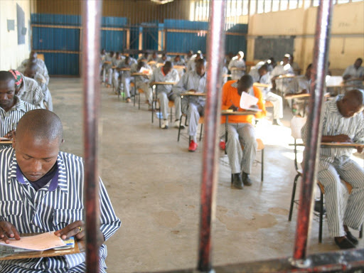Inmates at the Naivasha GK Prison take a Mathematics test during the 2013 Kenya Certificate of Primary Education exam. Photo/GEORGE MURAGE