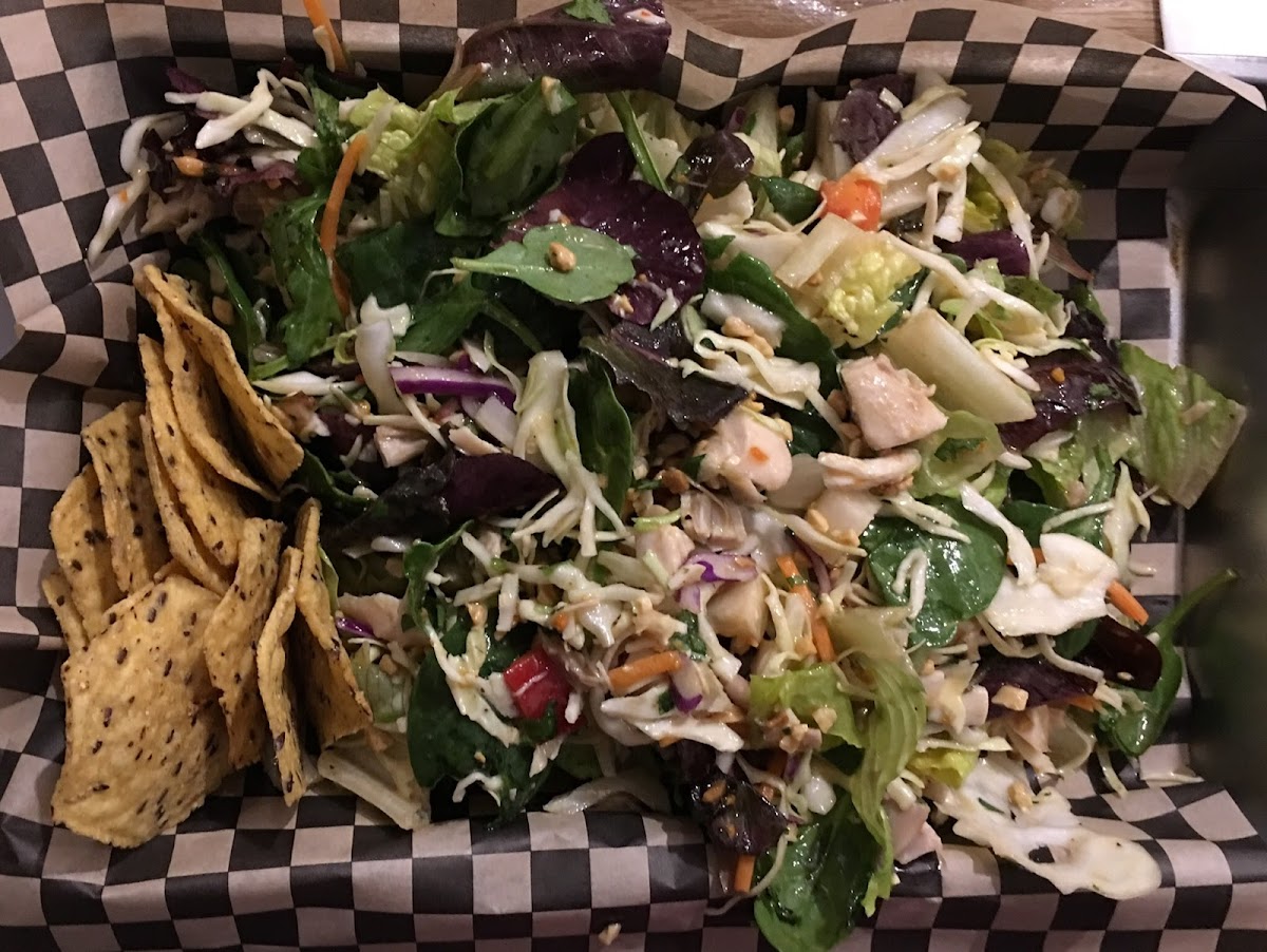 Asian Salad with Chicken and Sesame Peanut Dressing. Greens with cabbage, cucumber, jicama, red pepper, cilantro, Thai basil and peanuts.