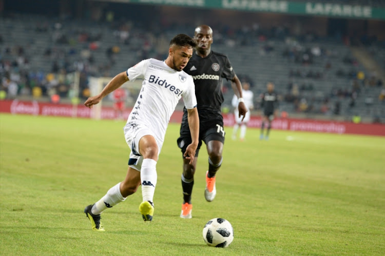 Haashim Domingo of Bidvest Wits pulls away from Musa Nyatama of Orlando Pirates during the Absa Premiership match at Orlando Stadium on August 15, 2018 in Johannesburg, South Africa.