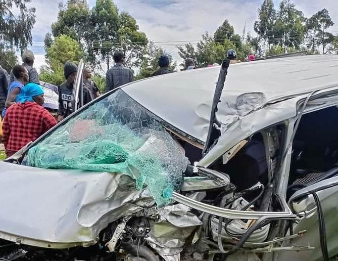 Residents of Murengeti area along the busy Nairobi-Nakuru highway watch one of the vehicles involved in an accident in the area.