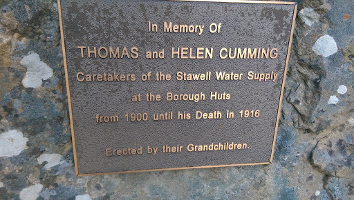 This plaque is in the Halls Gap Botanic Gardens laid in a large rock. Plaque reads: In Memory Of Thomas and Helen Cumming Caretakers of the Stawell Water Supply at the Borough Huts from 1900 until...